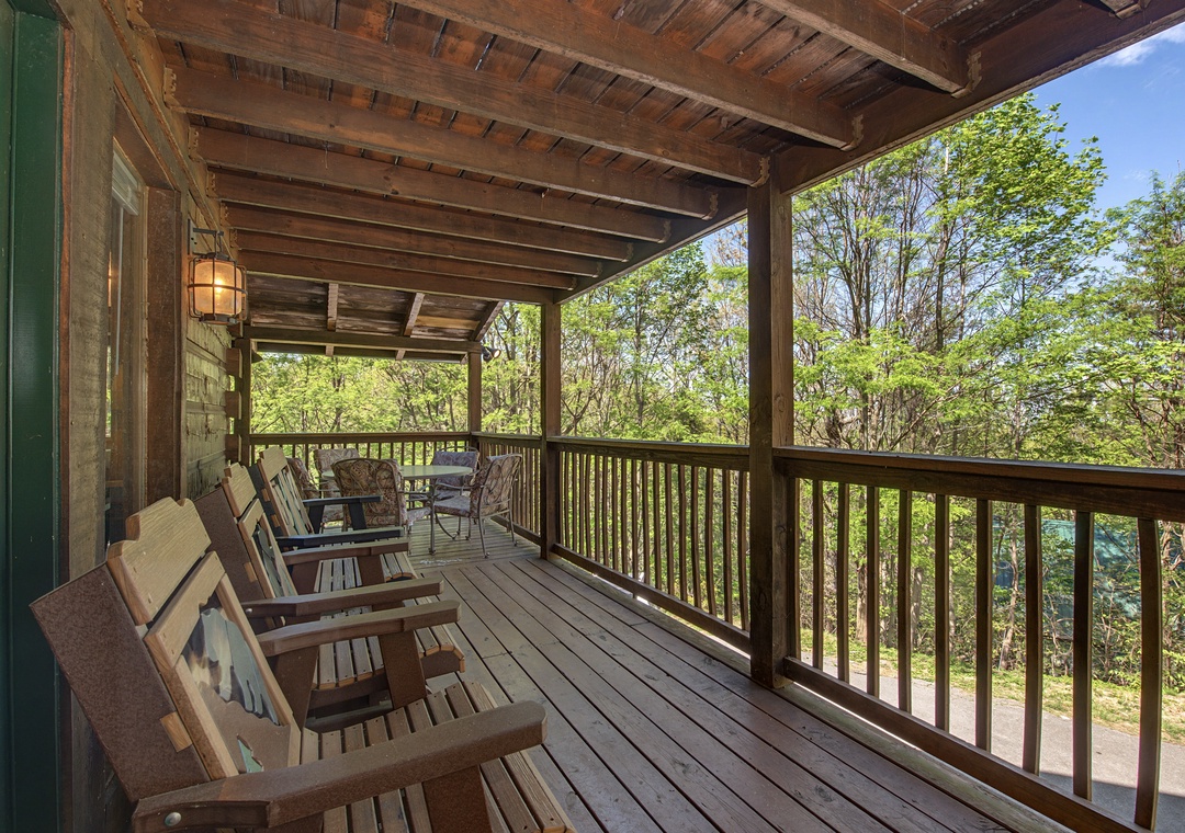 Unwind on your private covered porch with rustic charm and forest views through every window.
