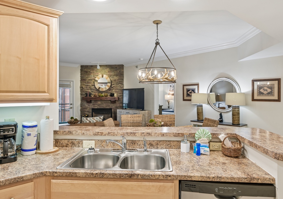 Your kitchen flows seamlessly into the living space, featuring granite counters and modern appliances for effortless meal prep while staying connected.