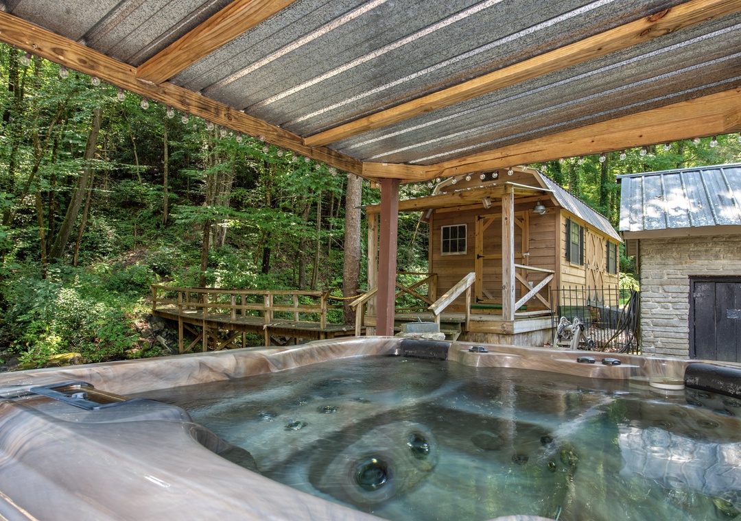 Slip into the warm, bubbling hot tub and let your worries melt away while you gaze out at the peaceful forest surrounding you.