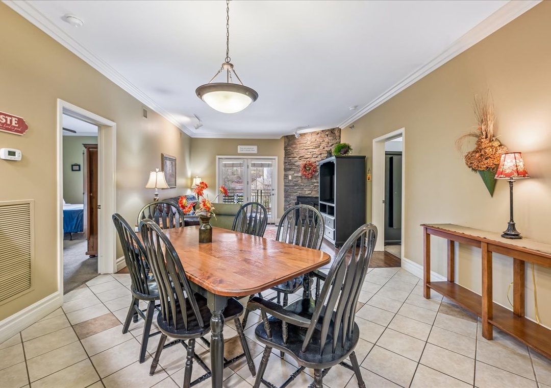 Gather around the warm wooden dining table where your family meals become cherished memories, surrounded by cozy lighting and thoughtful touches.