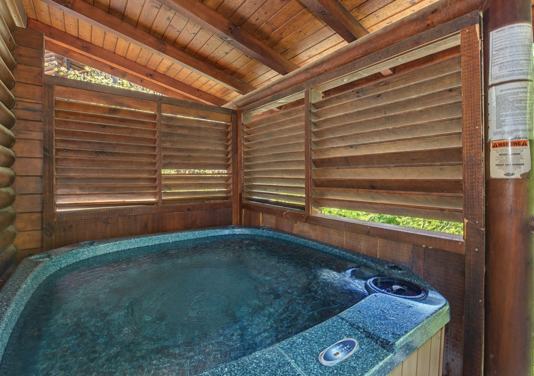 Soak away stress in your private hot tub, sheltered by warm wood and gentle louvered screens that filter light beautifully.