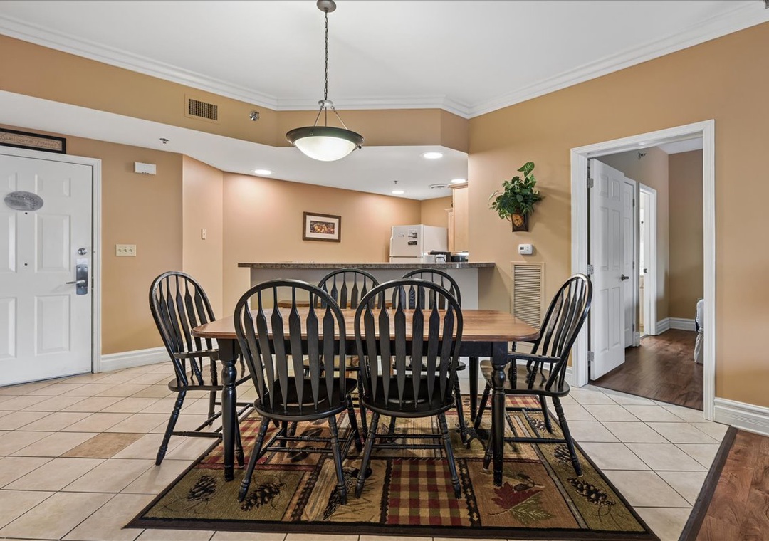 Gather around your spacious dining table for memorable meals with family and friends in this welcoming open-concept space.