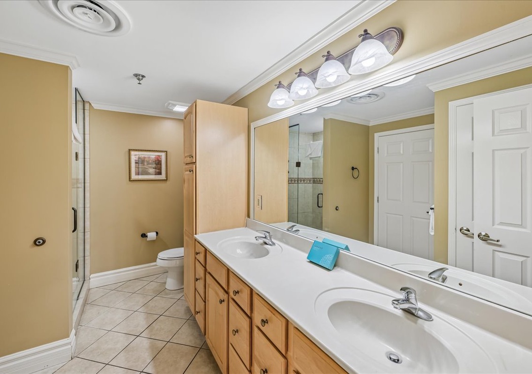 Your spacious master bathroom features dual vanities, elegant lighting, and a separate shower for your comfort and convenience.