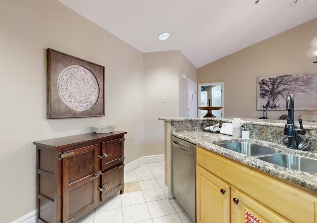 Your kitchen features granite countertops, modern appliances, and elegant wood cabinetry for comfortable meal preparation.