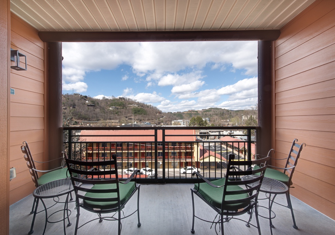 Relax on your private balcony with comfortable seating while enjoying scenic mountain and valley views.
