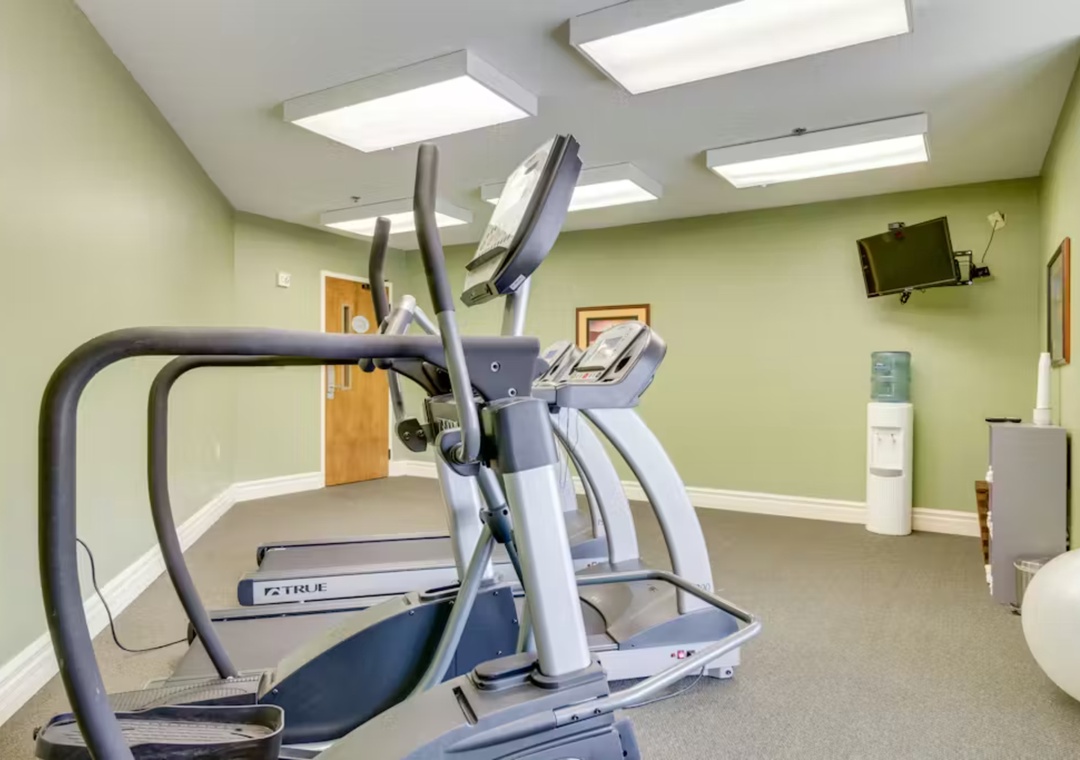 Your workout routine just got easier with modern cardio equipment in this bright, air-conditioned fitness room.