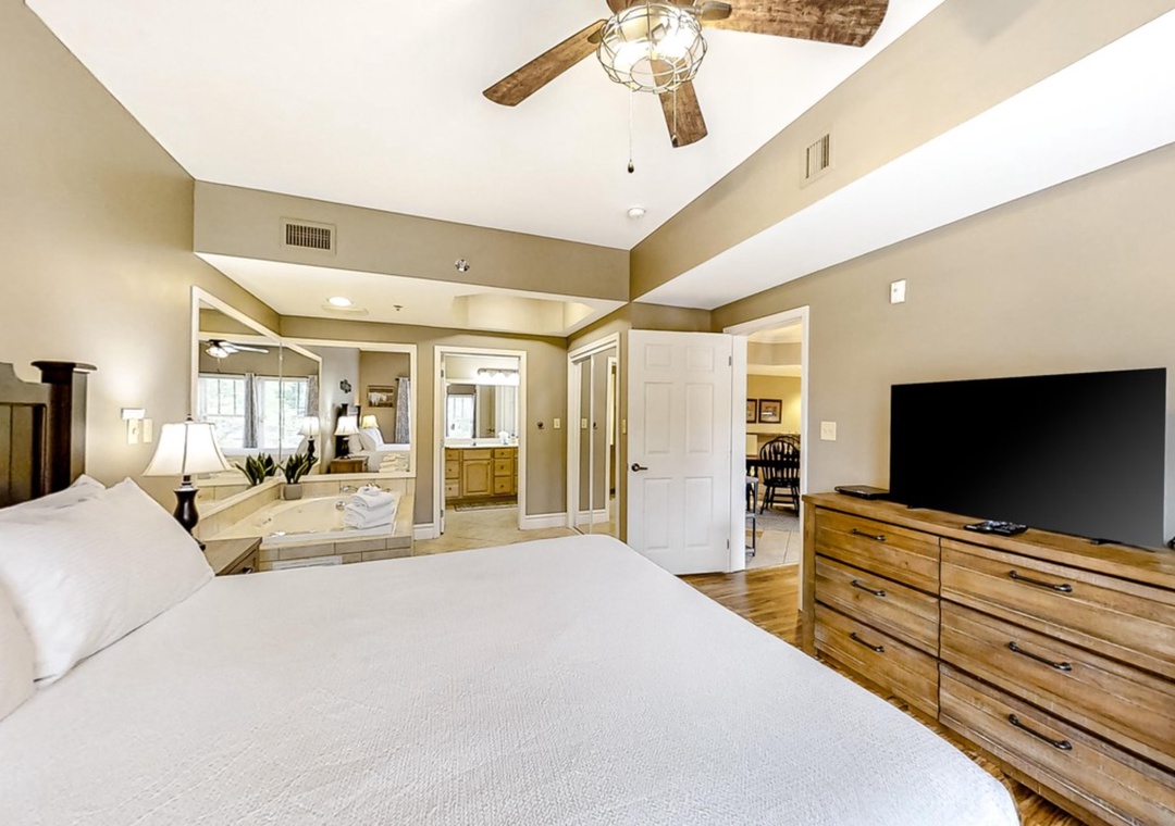 Your master suite sanctuary features vaulted ceilings, cozy bedding, and spa-like bathroom views for ultimate relaxation.