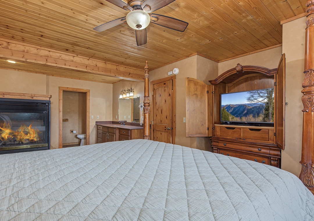 Retreat to your private sanctuary with a crackling fireplace and natural wood accents overhead, creating a cozy alpine escape where you can relax after a day of adventure.