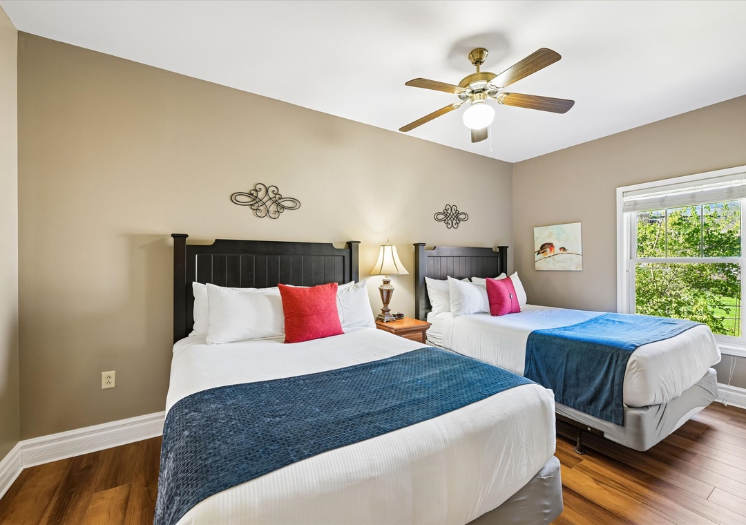 Drift into peaceful sleep in your comfortable twin bedroom, where soft linens and gentle ceiling fan breezes create the perfect restful retreat.
