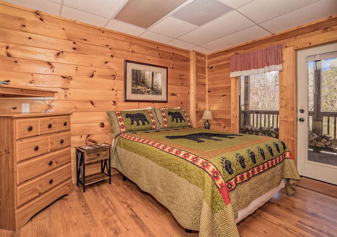 Drift off in this cozy log bedroom where rustic charm meets comfort, complete with beautiful forest views from your private balcony.