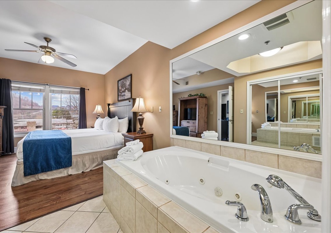 Unwind in your spacious suite featuring a king bed and luxurious jetted tub perfect for romantic evenings together.