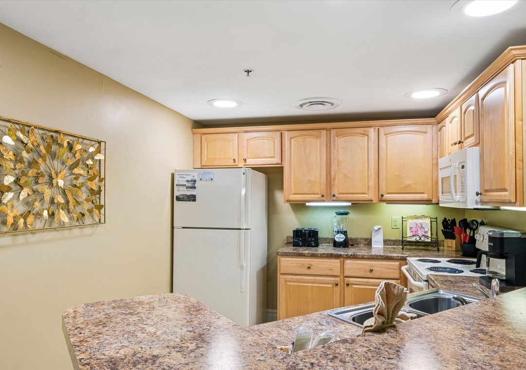 Your fully equipped kitchen features granite counters, maple cabinets, and everything needed for memorable meals during your stay.