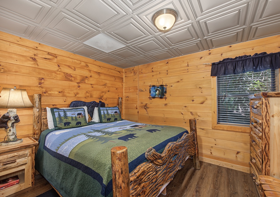 Drift off to sleep surrounded by warm pine walls and handcrafted log furnishings that bring rustic charm to every corner of your bedroom retreat.