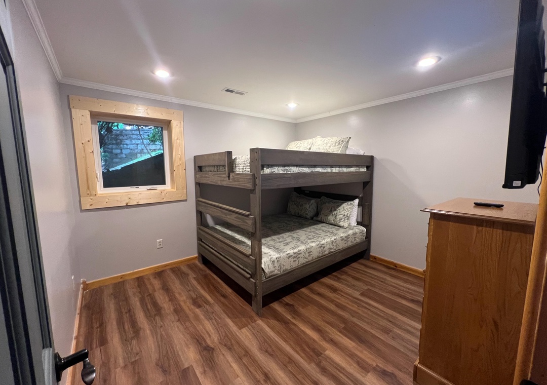Your cozy bunk room offers the perfect retreat after a day of adventure, with soft linens and rustic wood accents creating a warm, restful space for the whole family.