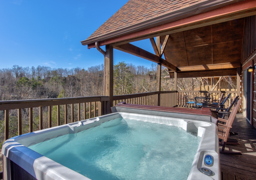 Soak in your private hot tub while soaking up mountain views from this covered deck—pure relaxation awaits.
