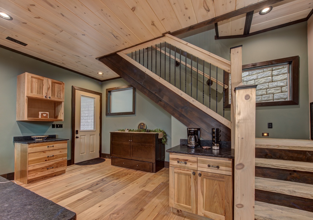 Your rustic kitchen welcomes you with warm wood finishes, granite counters, and coffee station for perfect mountain mornings.