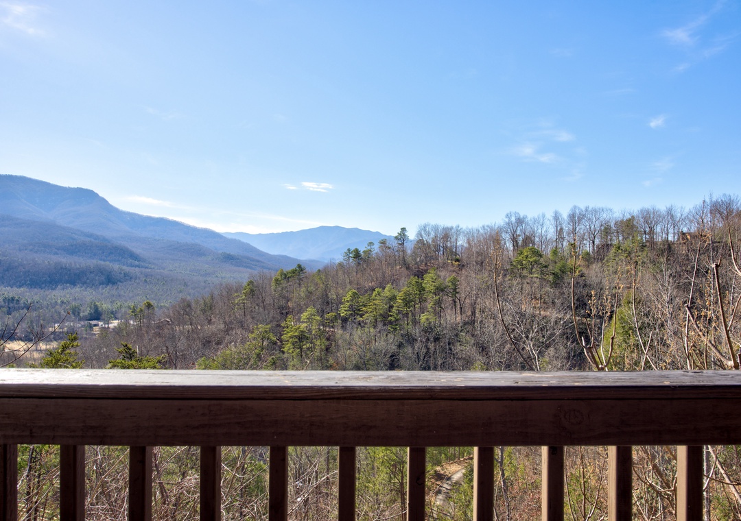 Breathtaking mountain views stretch endlessly from your private balcony, where morning coffee becomes a peaceful ritual surrounded by nature's grandeur.