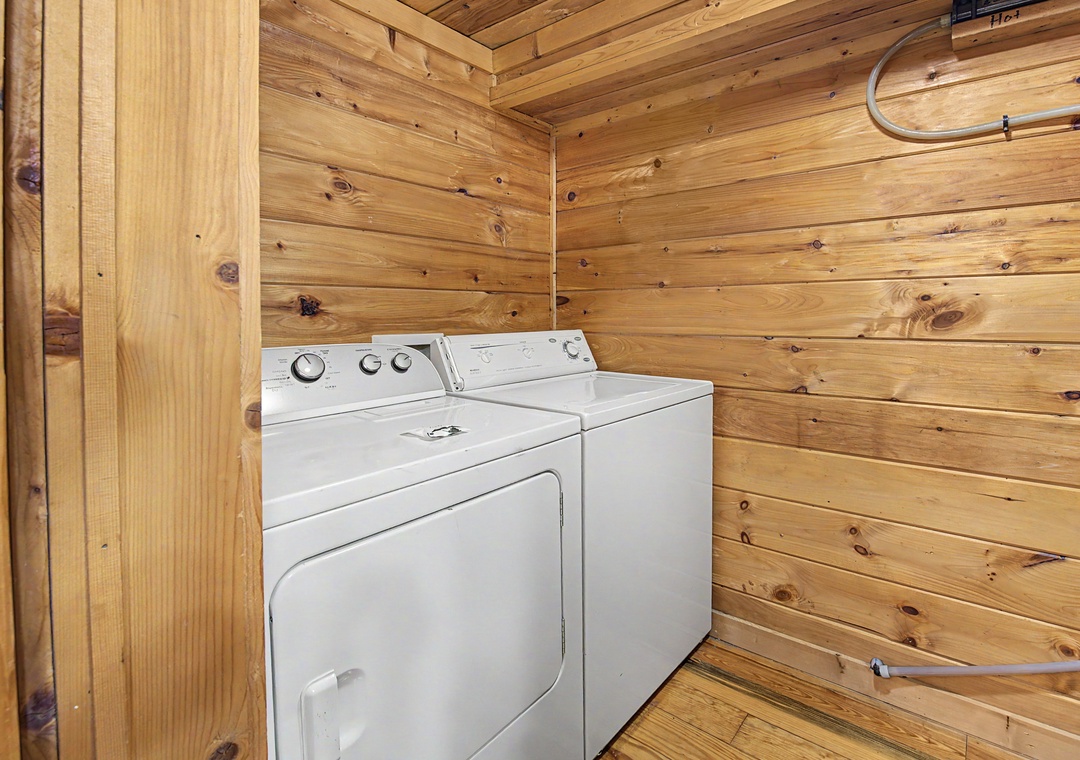 Your private laundry nook features full-size washer and dryer in warm cedar walls for fresh clothes during your stay.