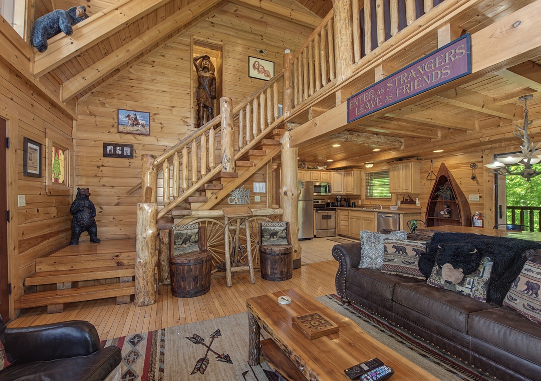 Step into your rustic retreat where warm wood surrounds you, cozy leather seating awaits, and whimsical bear decor creates mountain charm.
