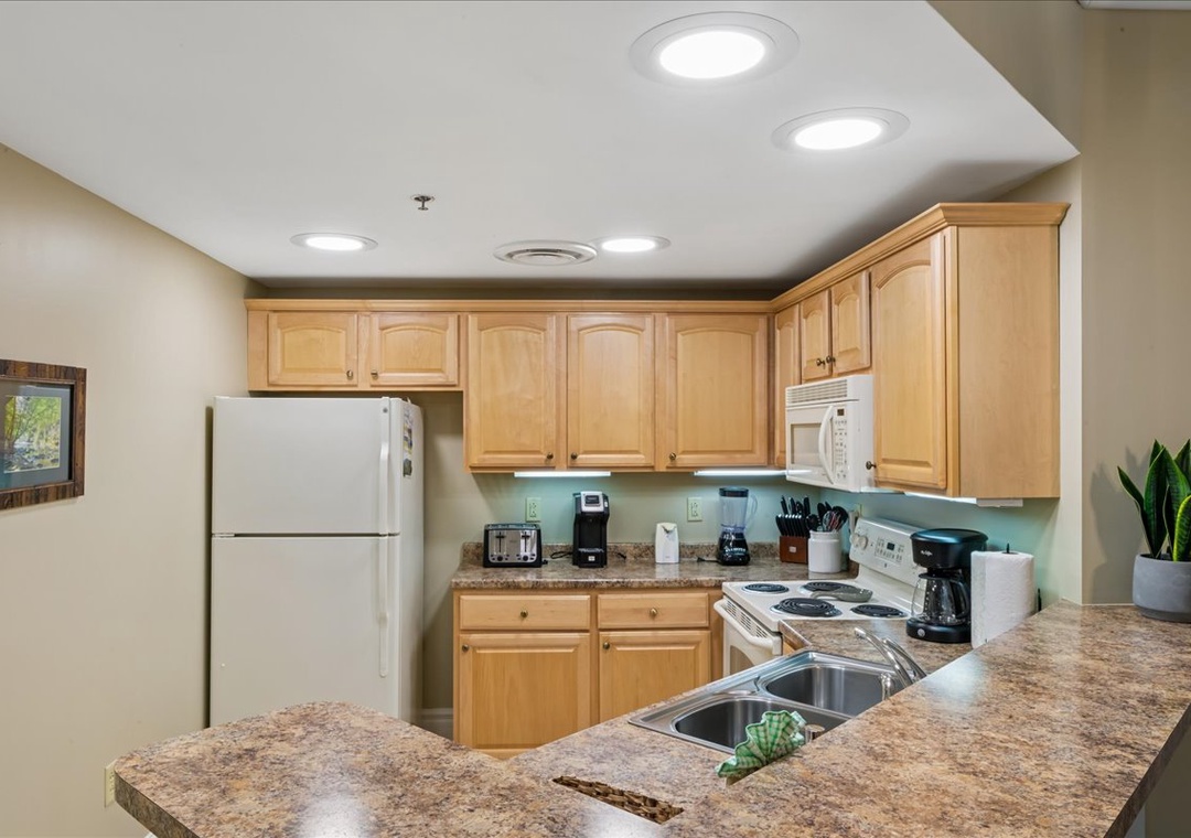 Your fully equipped kitchen awaits with granite countertops, modern appliances, and everything you need to create memorable meals during your stay.