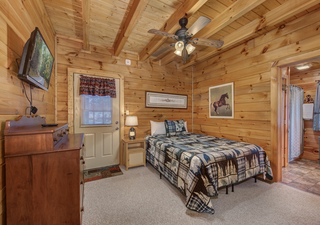 Cozy log cabin bedroom with rustic charm, plaid bedding, and all the comforts you need for a peaceful mountain retreat.