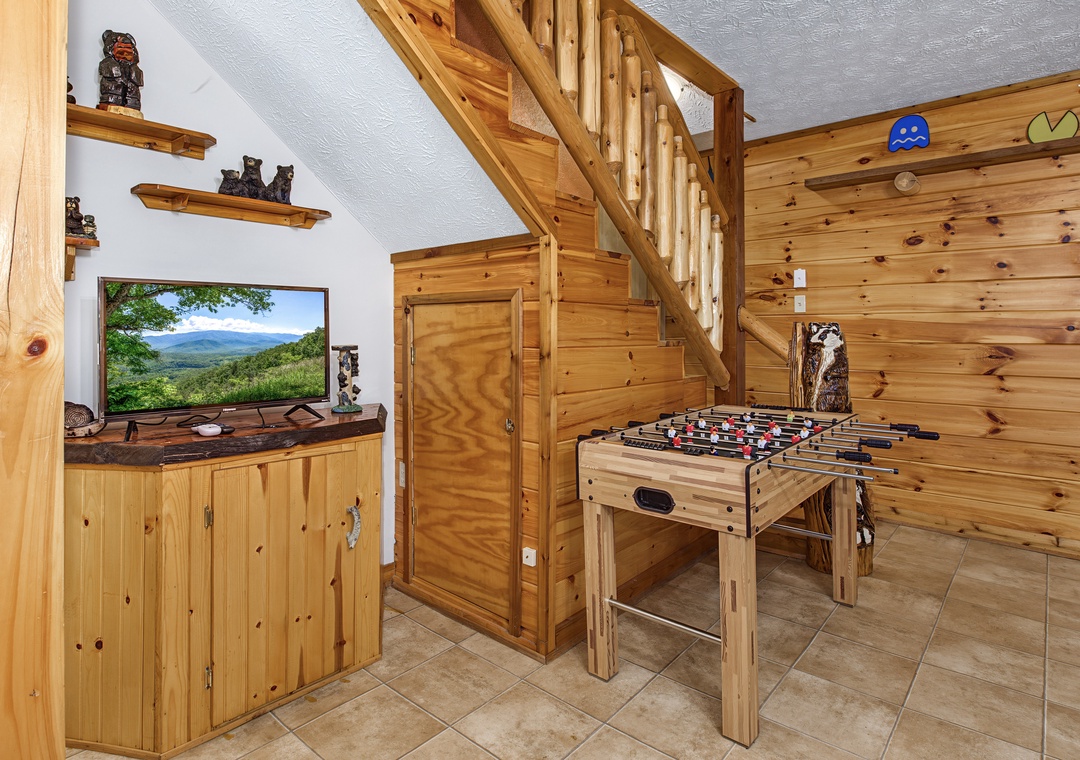 Your private game room awaits with foosball table and entertainment—perfect for friendly competition and laughter after a day of mountain adventures.