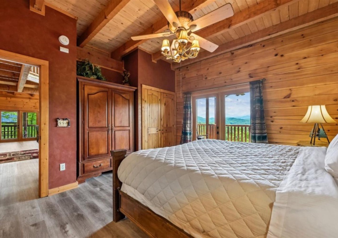 Your cozy mountain retreat features vaulted wood ceilings, a plush bed, and a stunning mountain view from your window. A perfect place to relax and recharge after exploring.