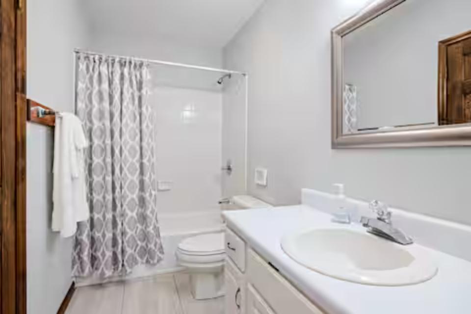 Step into your pristine bathroom with sparkling countertops, fresh towels, and a spacious shower-tub combo for unwinding after your adventures.