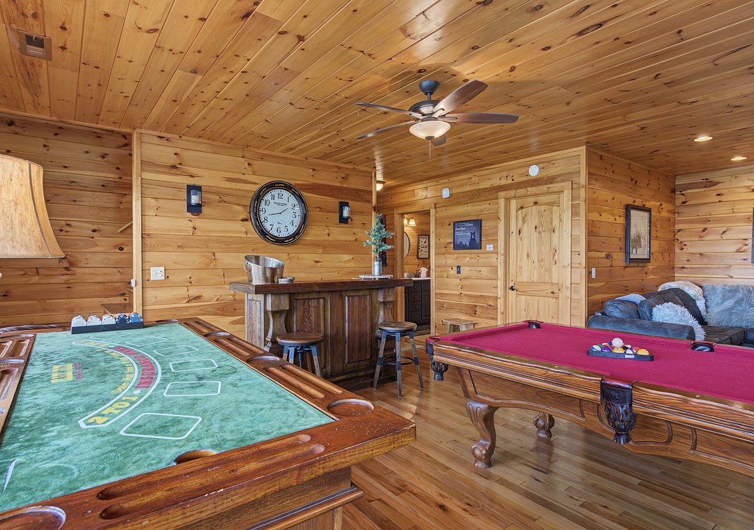 Unwind in your private game room with a billiards table, card table, and cozy seating—perfect for friendly competition and laughter after a day of adventure.