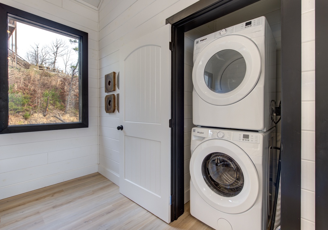 Keep your wardrobe fresh with this convenient in-unit laundry nook, thoughtfully tucked away yet easily accessible for your comfort.