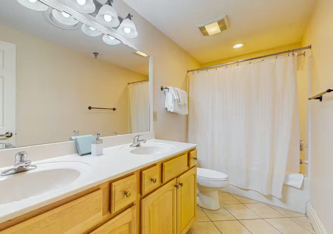 Refresh in your bright bathroom with dual vanities, plenty of counter space, and a relaxing tub-shower combo for unwinding after adventures.