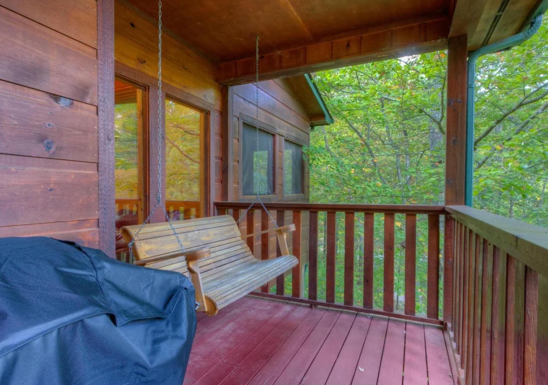 Swing gently on your private porch and breathe in the fresh forest air. Surrounded by lush trees, this cozy outdoor retreat is perfect for morning coffee or unwinding after exploring.