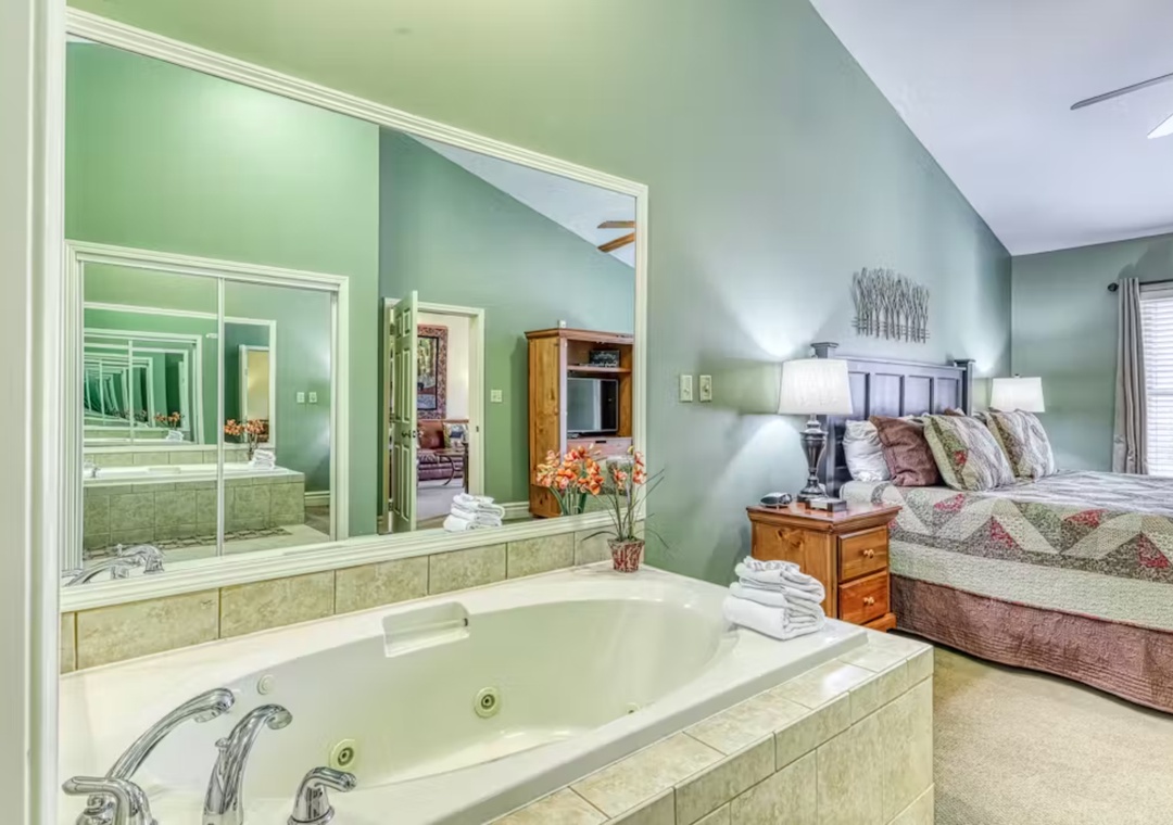 Unwind in your spacious bedroom featuring a luxurious jetted tub where you can soak away the day's adventures in complete comfort.