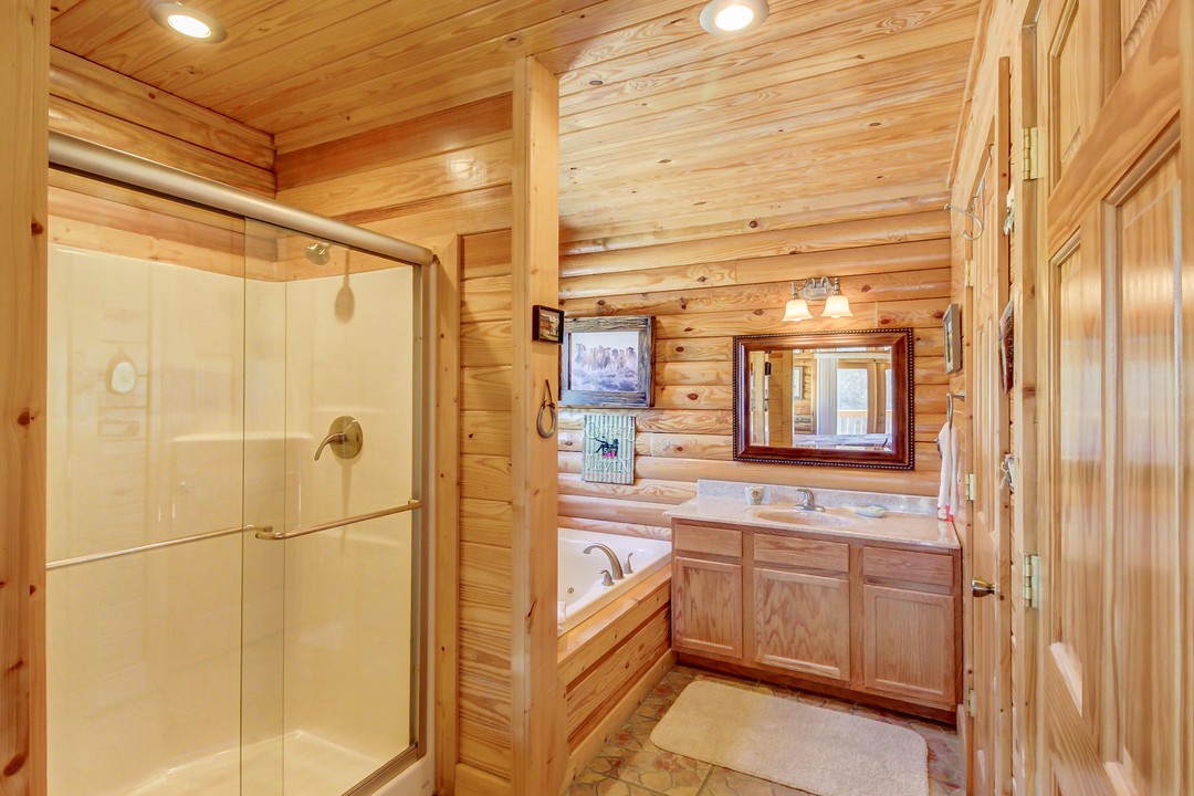 Refresh in your private bathroom, complete with a walk-in shower and soaking tub surrounded by warm wood finishes.