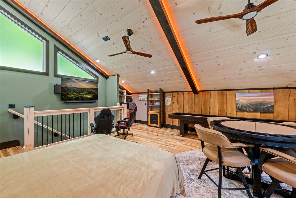 Your private loft retreat features cathedral ceilings, ambient lighting, and a gaming table perfect for memorable evenings with friends and family.