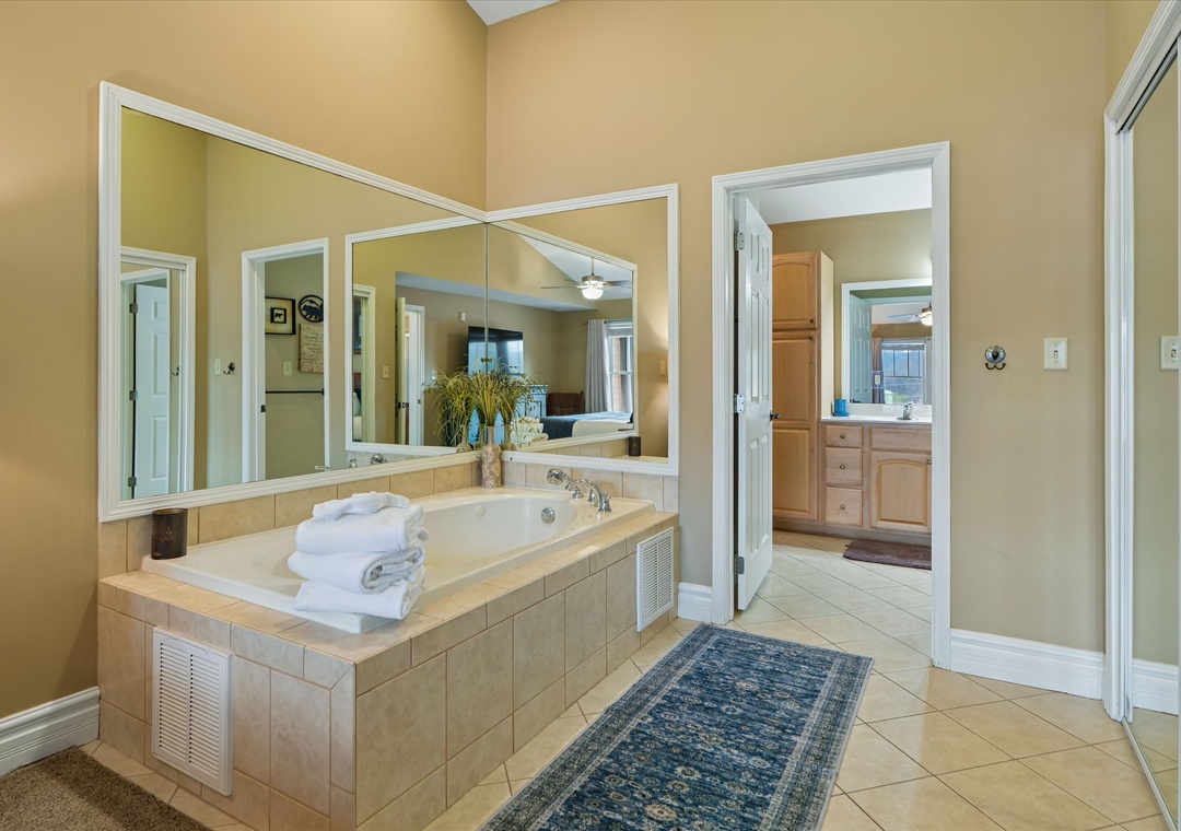 Sink into your private spa oasis with this luxurious jetted tub, perfectly positioned for ultimate relaxation and rejuvenation.