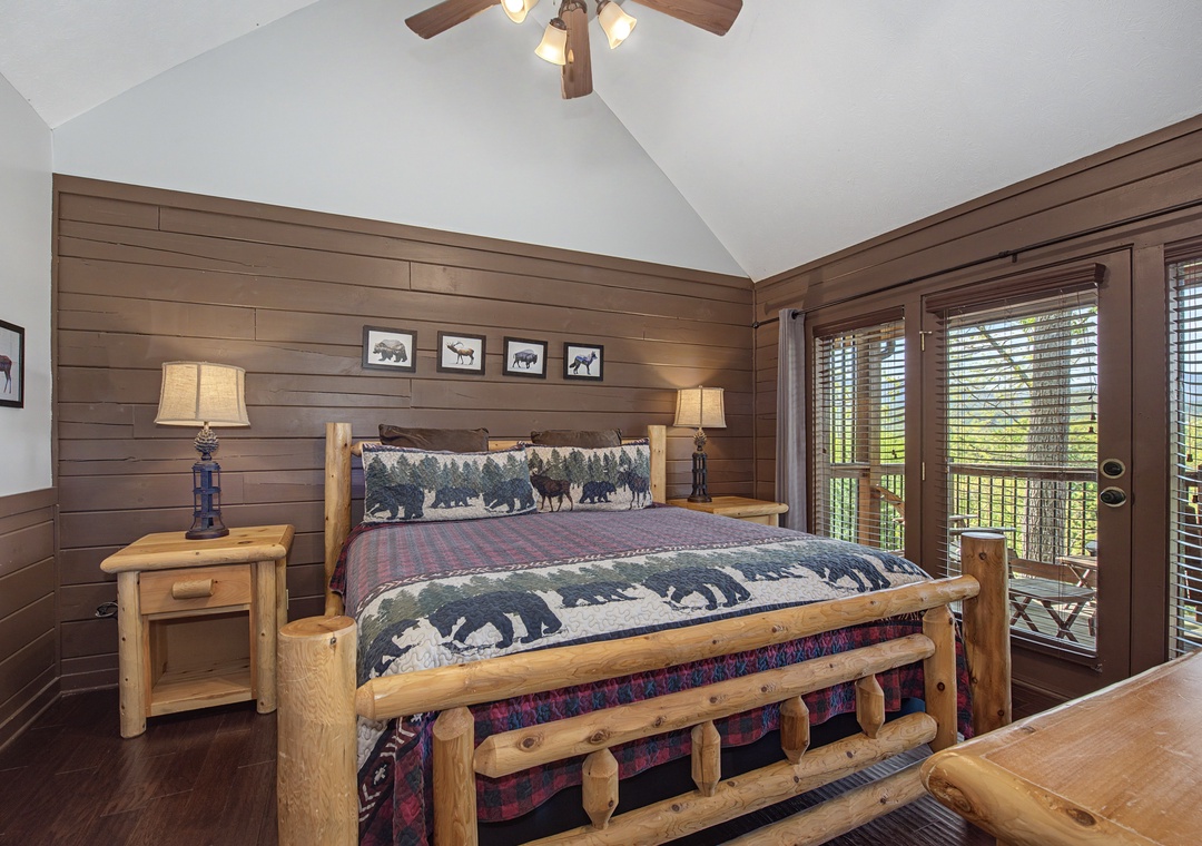 Retreat to your cozy log-style bedroom where rustic charm meets comfort, complete with wildlife-themed bedding and your own private balcony overlooking scenic views.