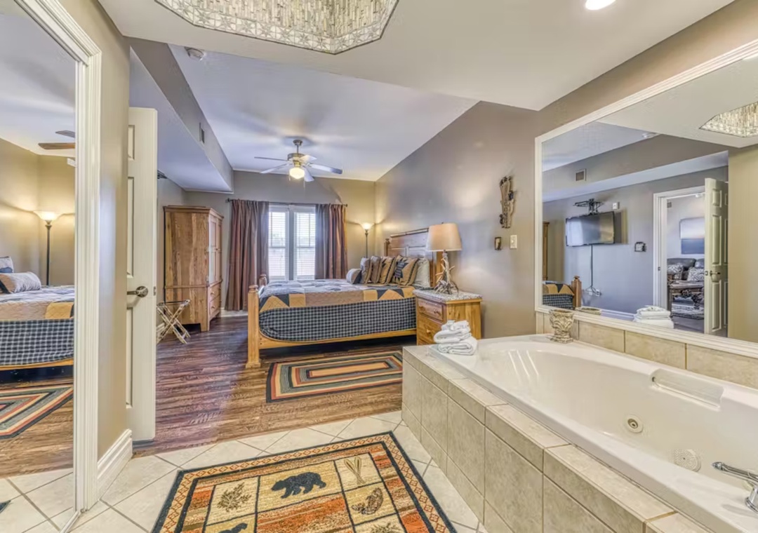 Soak your cares away in your private jetted tub while enjoying views into the spacious bedroom suite.