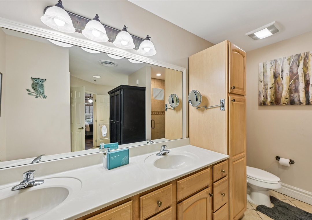 Step into your spacious bathroom with dual sinks, ample storage, and thoughtful touches that make your morning routine feel luxurious.