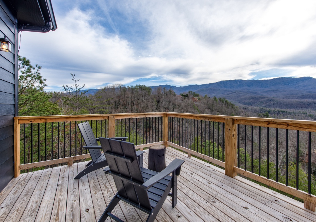 Relax on your private deck with Adirondack chairs while soaking in breathtaking mountain vistas that stretch endlessly before you.