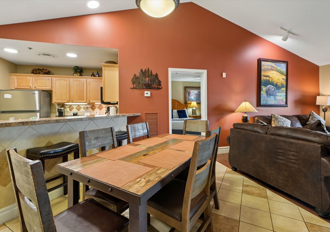 Gather around your spacious dining table for memorable meals while enjoying the warm ambiance of your fully equipped kitchen and comfortable living area.