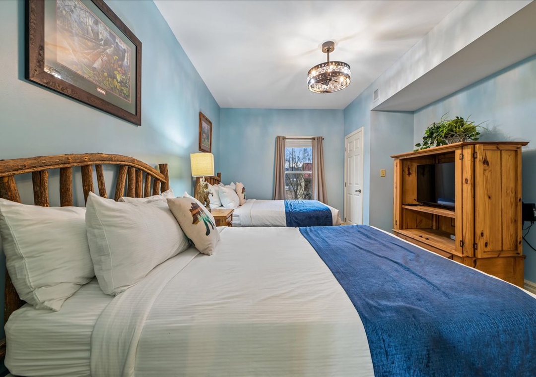 Drift into peaceful dreams in your tranquil bedroom with rustic wood headboards, calming blue accents, and cozy linens.