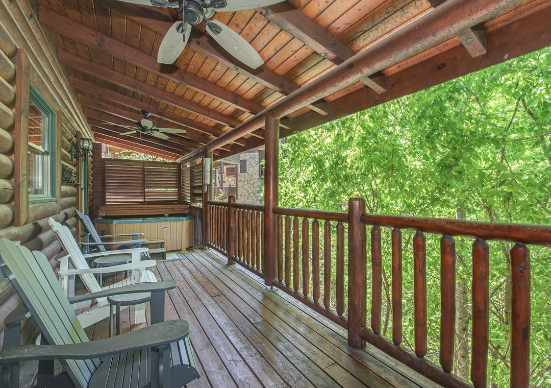 Unwind on your private covered deck with hot tub, surrounded by lush forest views and rustic charm.