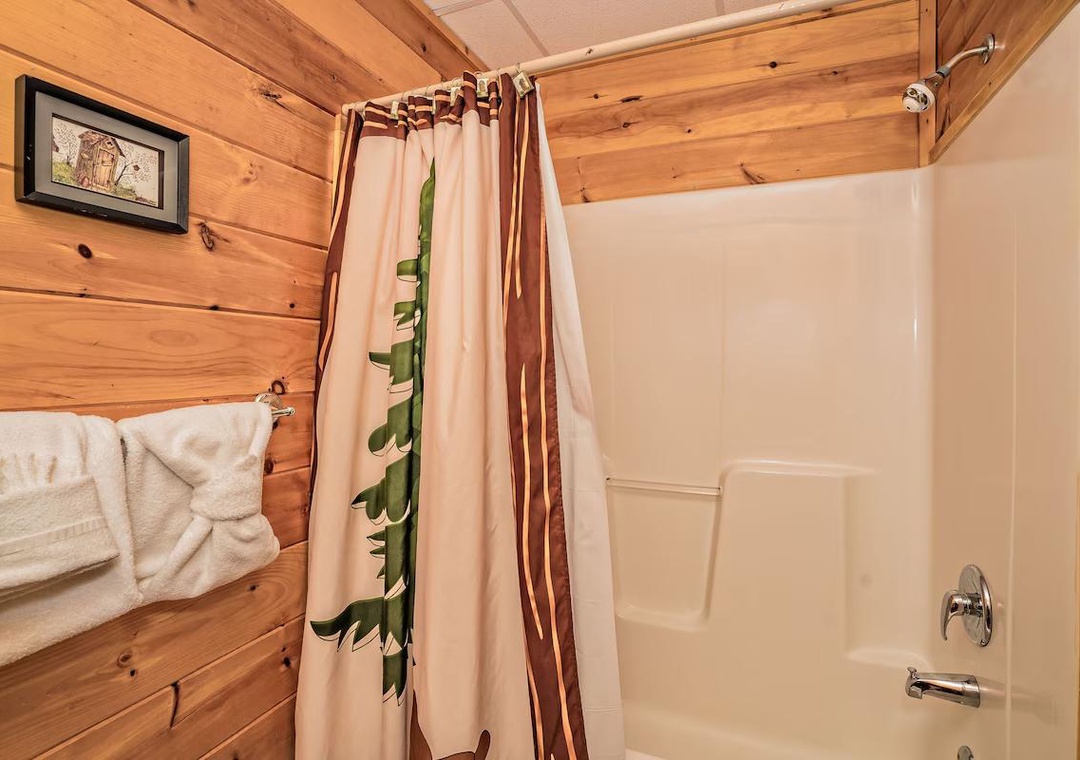Refresh in your rustic bathroom with warm wood walls and plush towels waiting for you after a perfect mountain day.