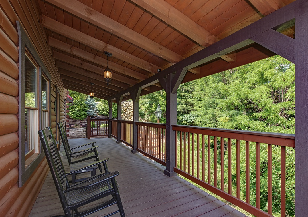 Sink into your rocking chair on this covered porch and breathe in the fresh mountain air, surrounded by towering trees and peaceful forest views.