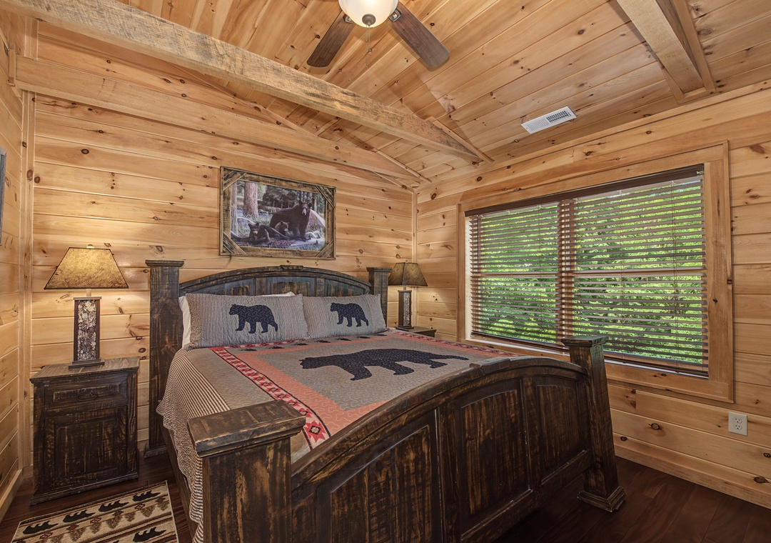 Drift off surrounded by warm pine walls and rustic charm. Your cozy bedroom features nature-inspired décor, soft lighting, and peaceful views of the forest just beyond your window.