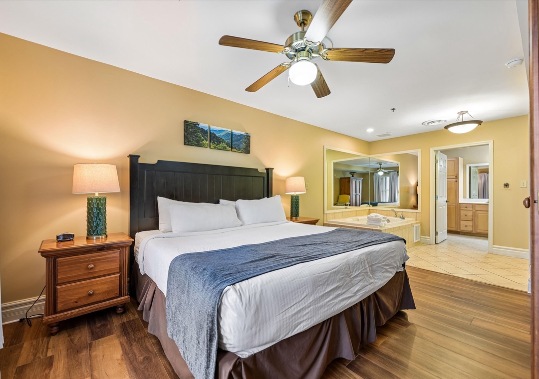 Your spacious bedroom features a comfortable king bed with crisp linens and a relaxing ceiling fan to keep you cool.