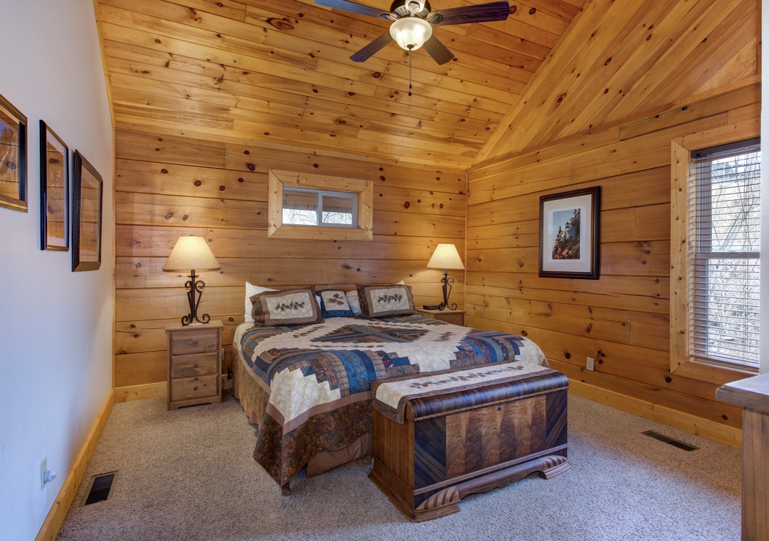 Retreat to your cozy cabin bedroom with rustic wood walls, soft quilted bedding, and gentle lamplight creating the perfect mountain getaway.