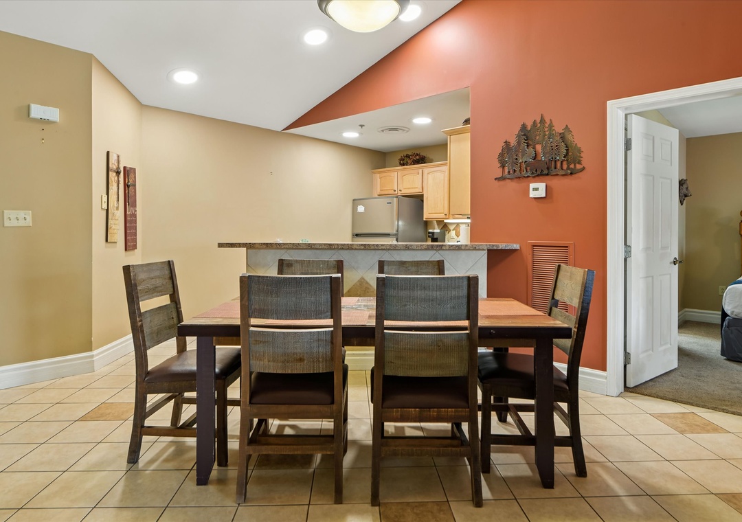 You'll love gathering around this spacious dining table for memorable meals, with warm lighting and a fully equipped kitchen nearby for easy entertaining.