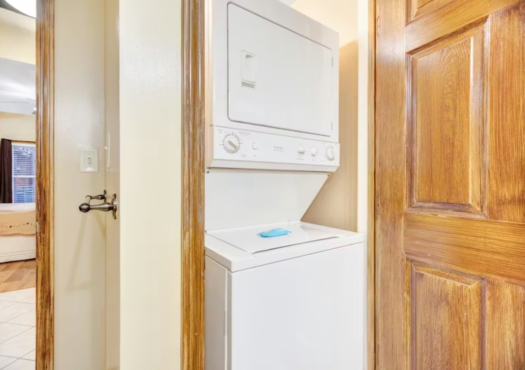 Your convenient in-unit washer and dryer keep your clothes fresh throughout your stay, tucked away in this thoughtfully designed laundry nook.